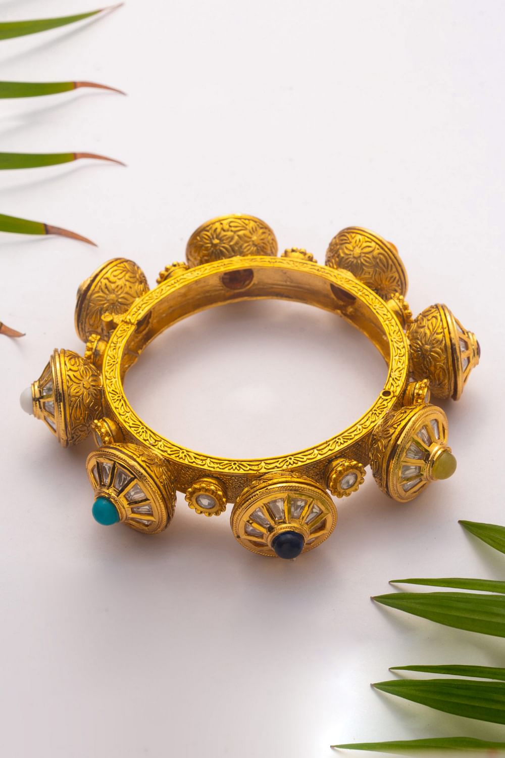 Buy Gold embellished kundan navaratna kada by Zevar By Geeta at Aashni and Co