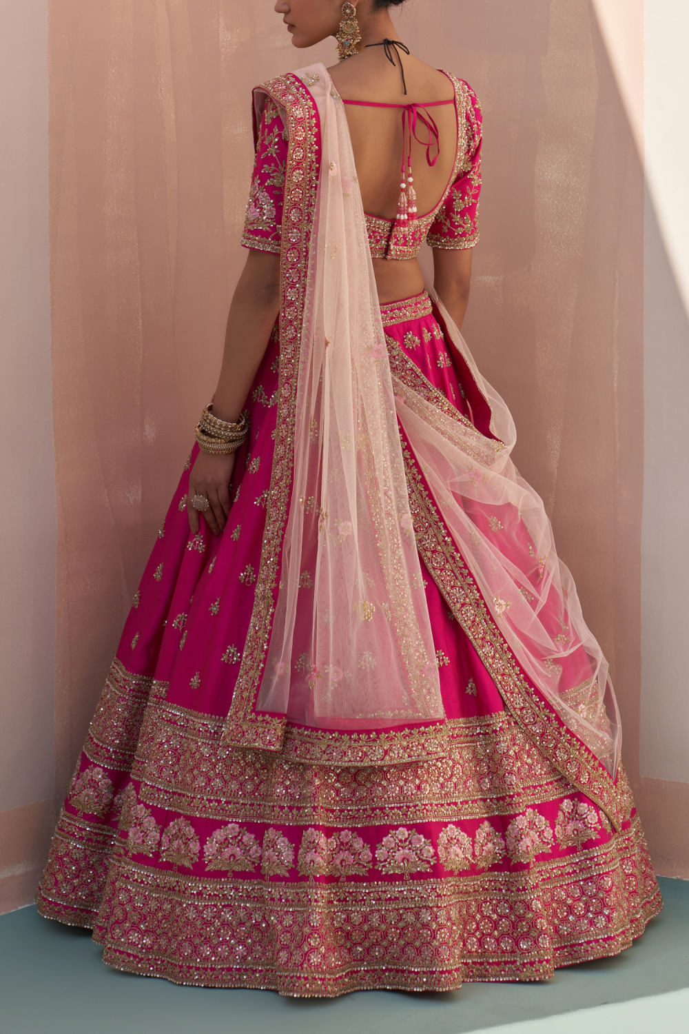 Buy Rani pink floral zardozi embroidery lehenga set by Angad Singh at