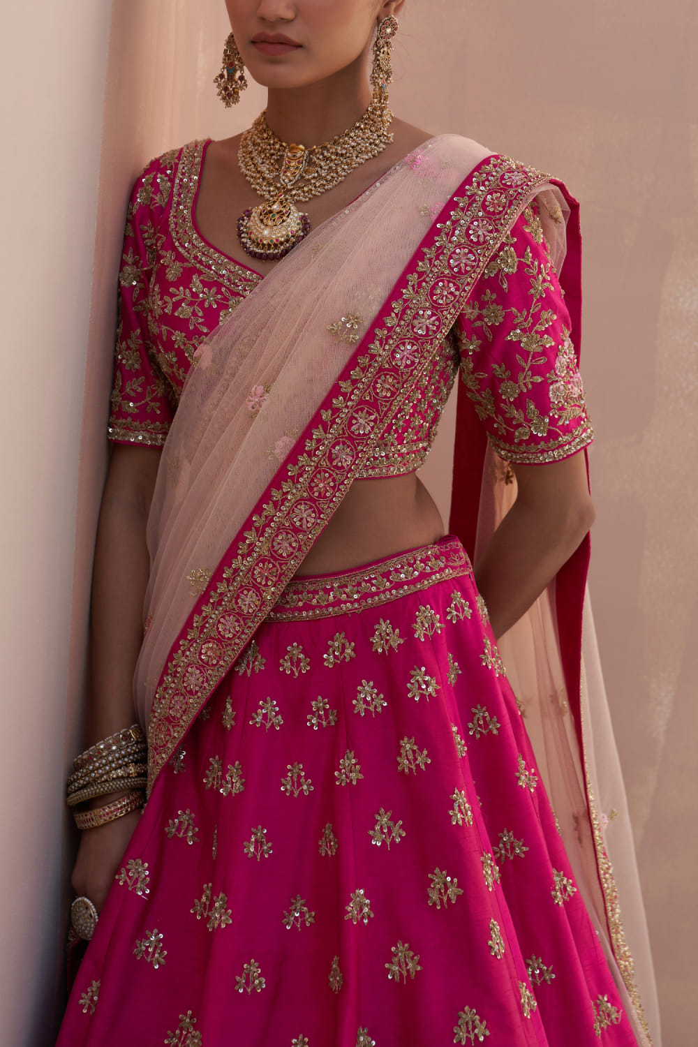 Buy Rani pink floral zardozi embroidery lehenga set by Angad Singh at