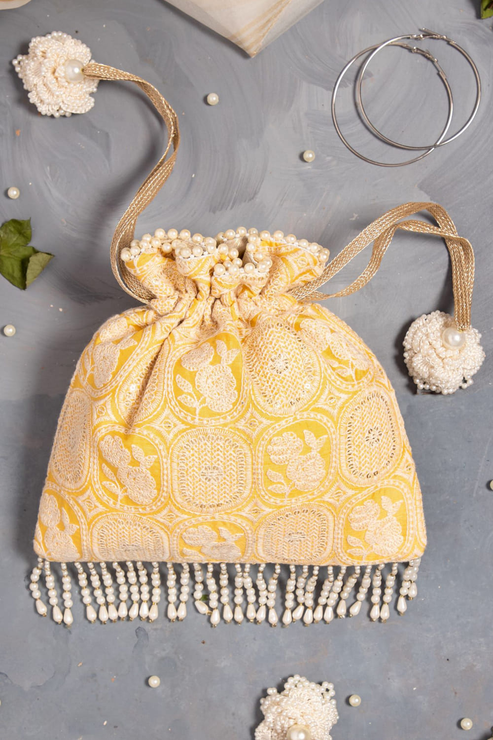 Buy Yellow threadwork embellished potli bag by Amyra at Aashni and Co