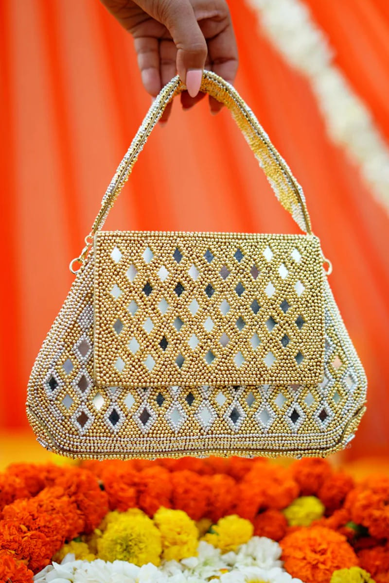 Buy Gold mirror embellished handbag by Vaidaan at Aashni and Co