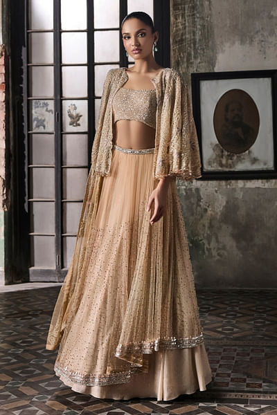 Light peach embellished cape and lehenga set