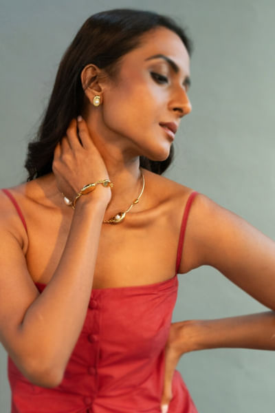 Gold and pearl embellished stud earrings