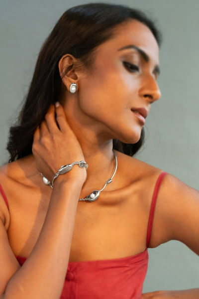 Silver and pearl embellished stud earrings