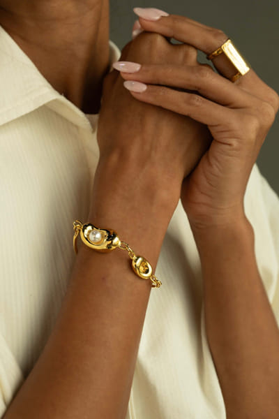 Gold and pearl embellished bracelet