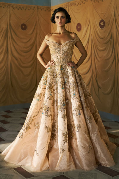 Beige and gold embroidered off-shoulder gown