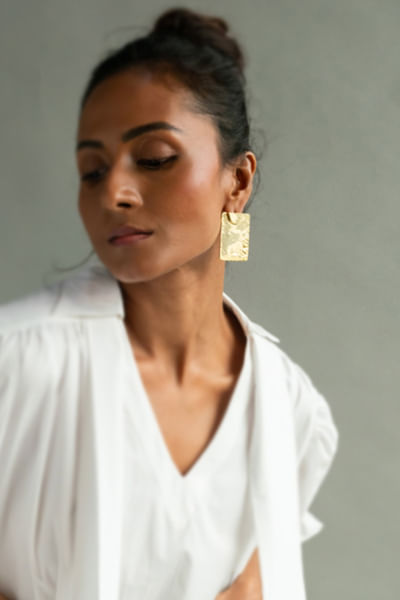 Gold wave textured statement earrings