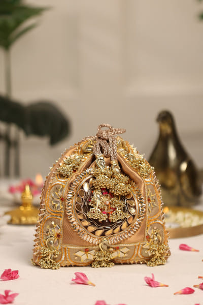 5 Elements by Radhika Gupta Gold embellished potli bag 5ELEJUN26D148327