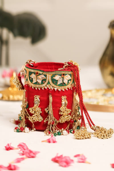 5 Elements by Radhika Gupta Red peacock embellished velvet potli bag 5ELEJUN26D148336