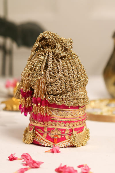 5 Elements by Radhika Gupta Pink and gold zari embellished potli bag 5ELEJUN26D148337