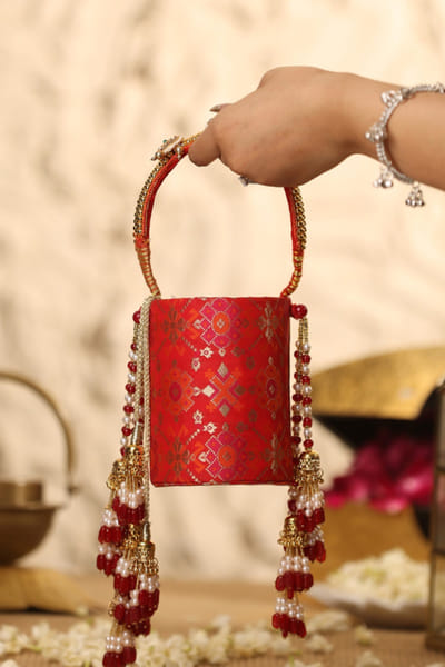 5 Elements by Radhika Gupta Red pearl and bead embellished potli bag 5ELEJUN26D148348