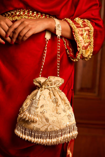 Off white embroidered potli bag