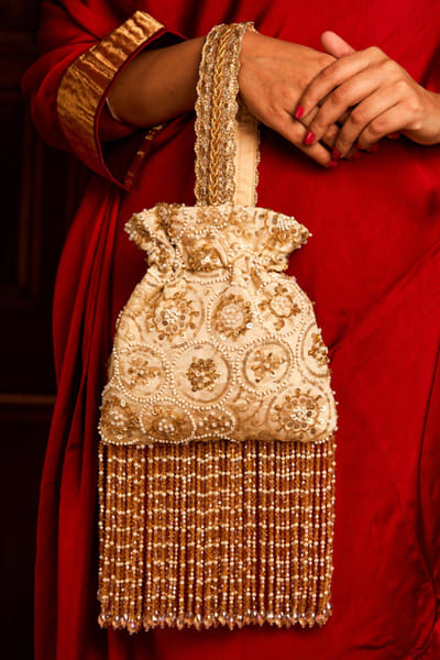 Off white thread embroidered potli bag