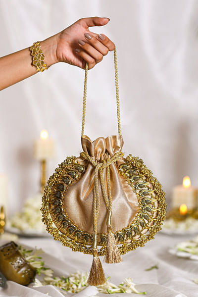 Gold bird ghungroo detail brocade potli bag