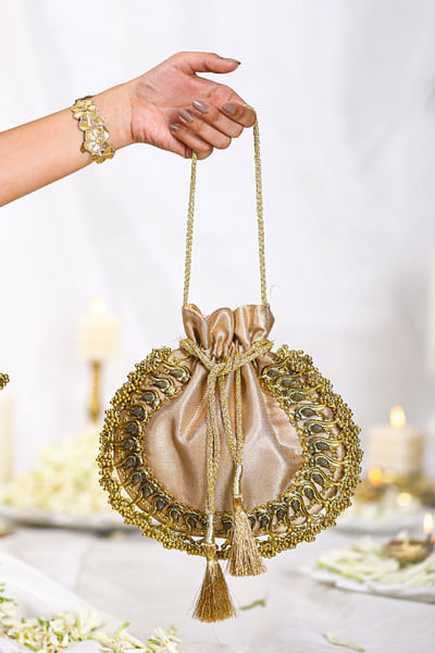 Gold ghungroo bird detail brocade potli bag