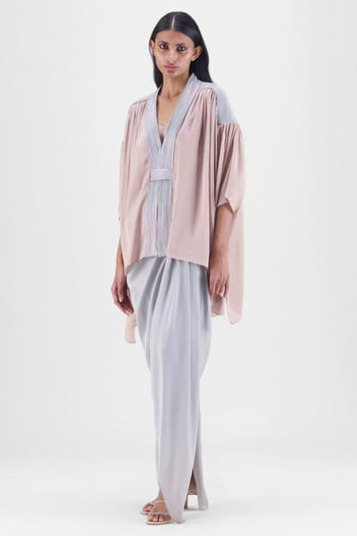 Skin and steel corded cape-draped skirt set