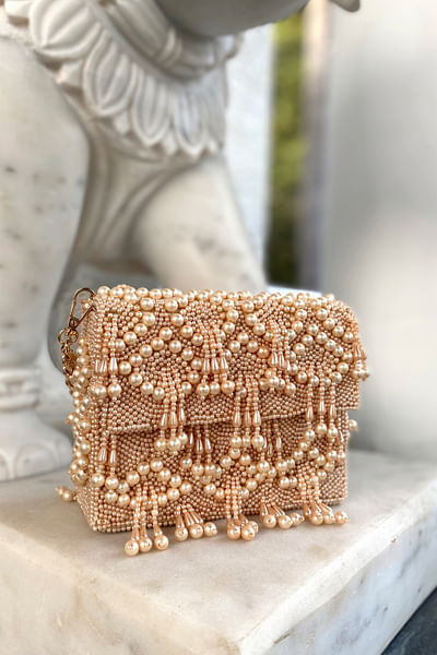 Gold pearl embellished clutch bag