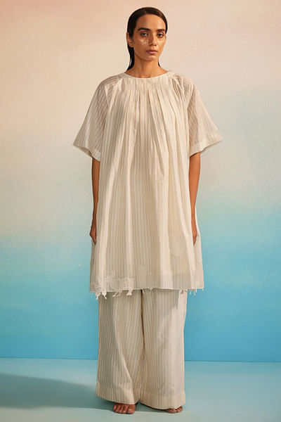 Ivory appliquéd and box pleated tunic