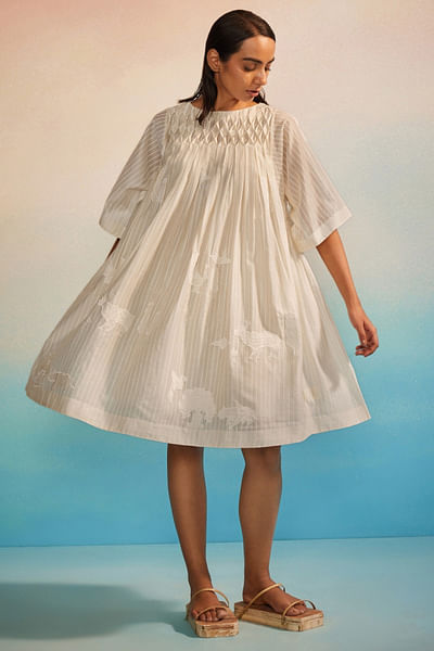 Ivory appliquéd and smocked dress