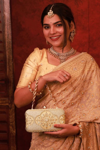 Beige embroidered suede metal clutch