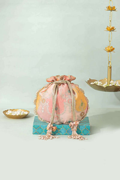 Peach abstract woven banarasi silk potli bag