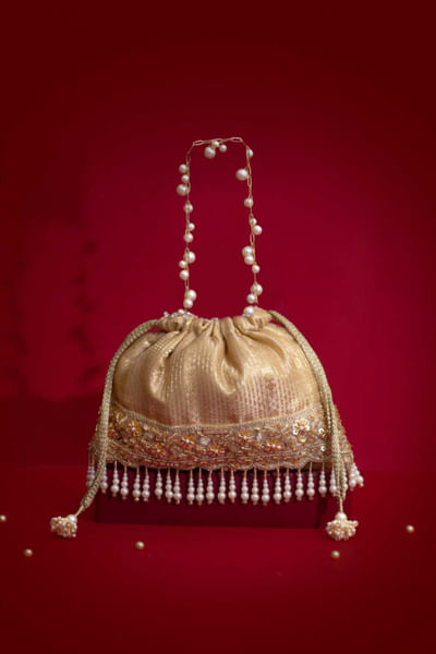 Beige tassel embellished potli bag