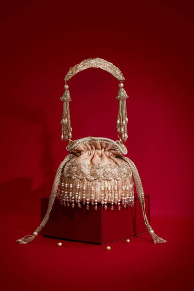 Pink cutdana fringe embellished potli bag