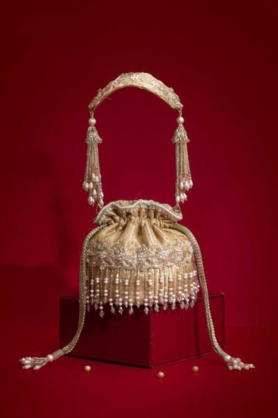 Beige cutdana fringe embellished potli bag