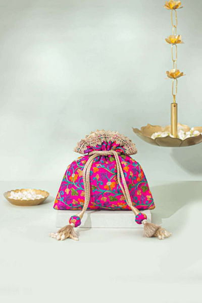 Pink embroidered and tasselled potli bag