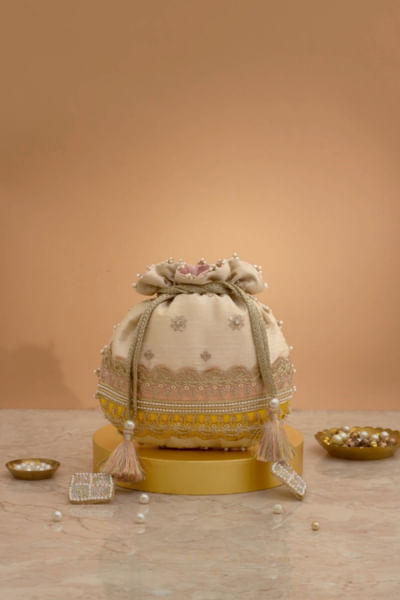 Pink and yellow embroidered potli bag