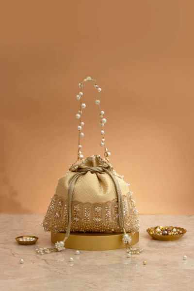 Cream pearl embellished potli bag
