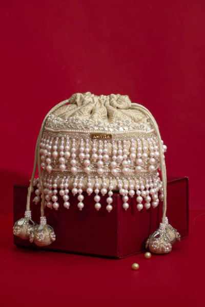 Ivory pearl fringe embellished potli bag