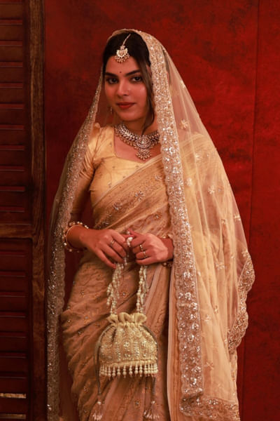 Gold pearl embroidered mini potli bag