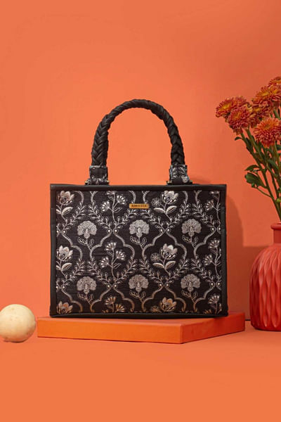 Black thread embroidered handbag
