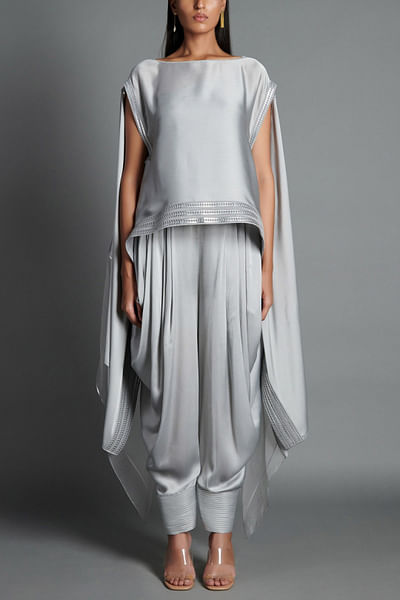 Grey poncho and draped pants