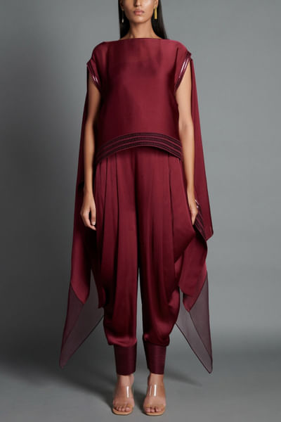 Plum poncho and draped pants