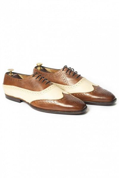 White and tan leather brogues