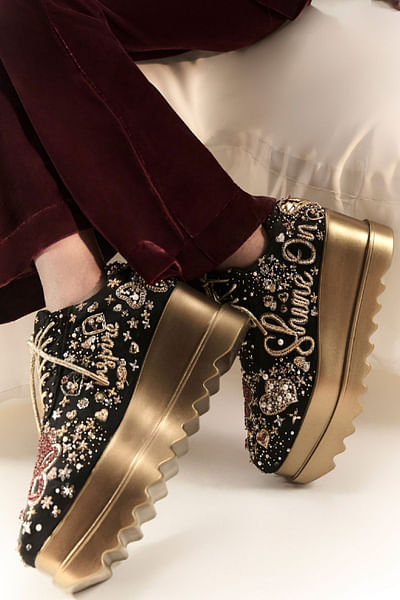 Black embroidered wedge sneakers