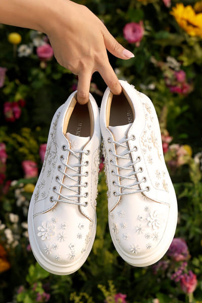 Anaar White tonal laser cut 3D floral sneakers ANAAJUN26D146882