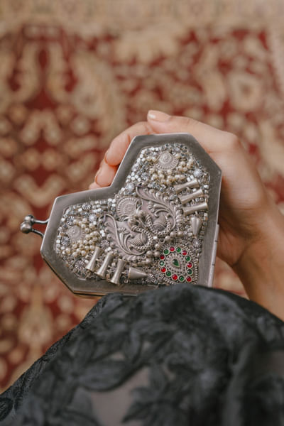 Silver embellished clutch
