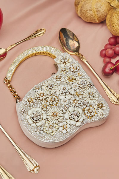 White floral metallic clutch