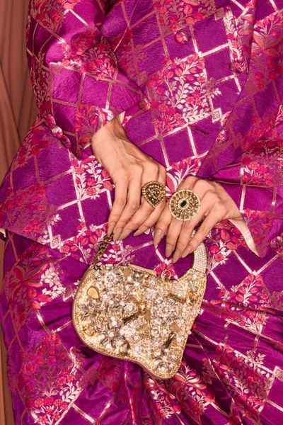 Gold stones embellished clutch