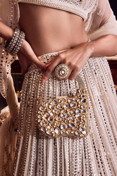 Gold jadau stones clutch
