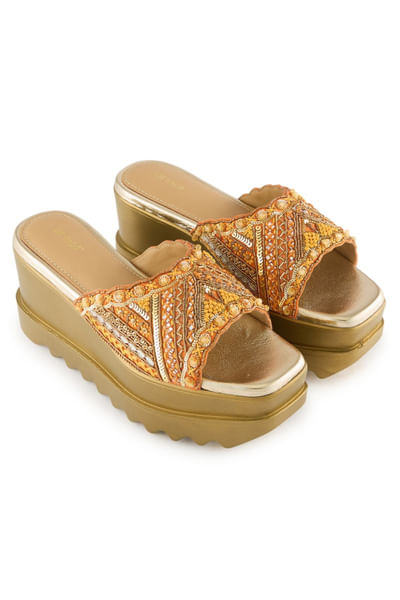 Orange embroidered slip-on sandals