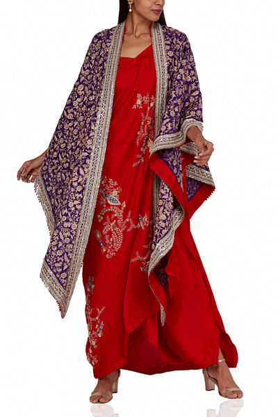 Red draped sari with cape