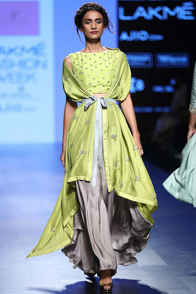 Green cape with crop top and grey pants