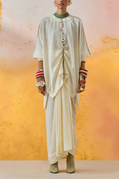 White tasselled top and skirt