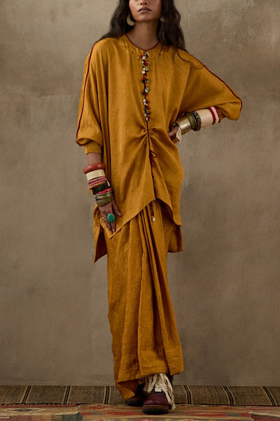 Yellow tasselled top and skirt