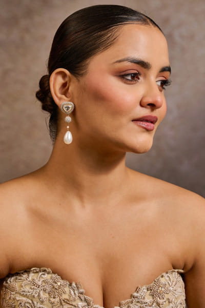 Gold pearl embellished long earrings