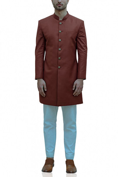 Rust achkan with white kurta and pants